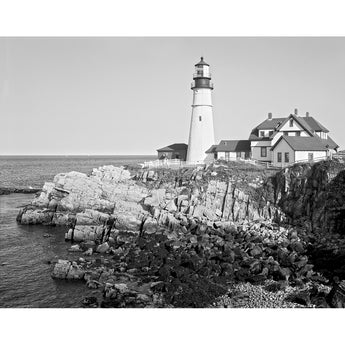 A vintage photograph of the Portland Head Light on the coast of Maine