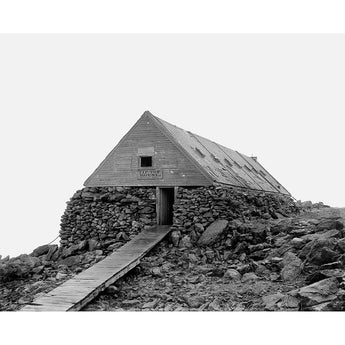 A vintage photograph of the Tip-Top House on Mount Washington