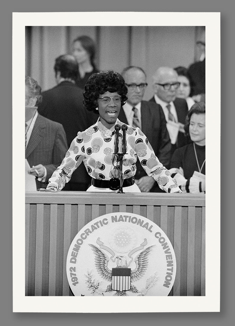 A paper print of a vintage photo of Shirley Chisholm speaking at the 1972 DNC