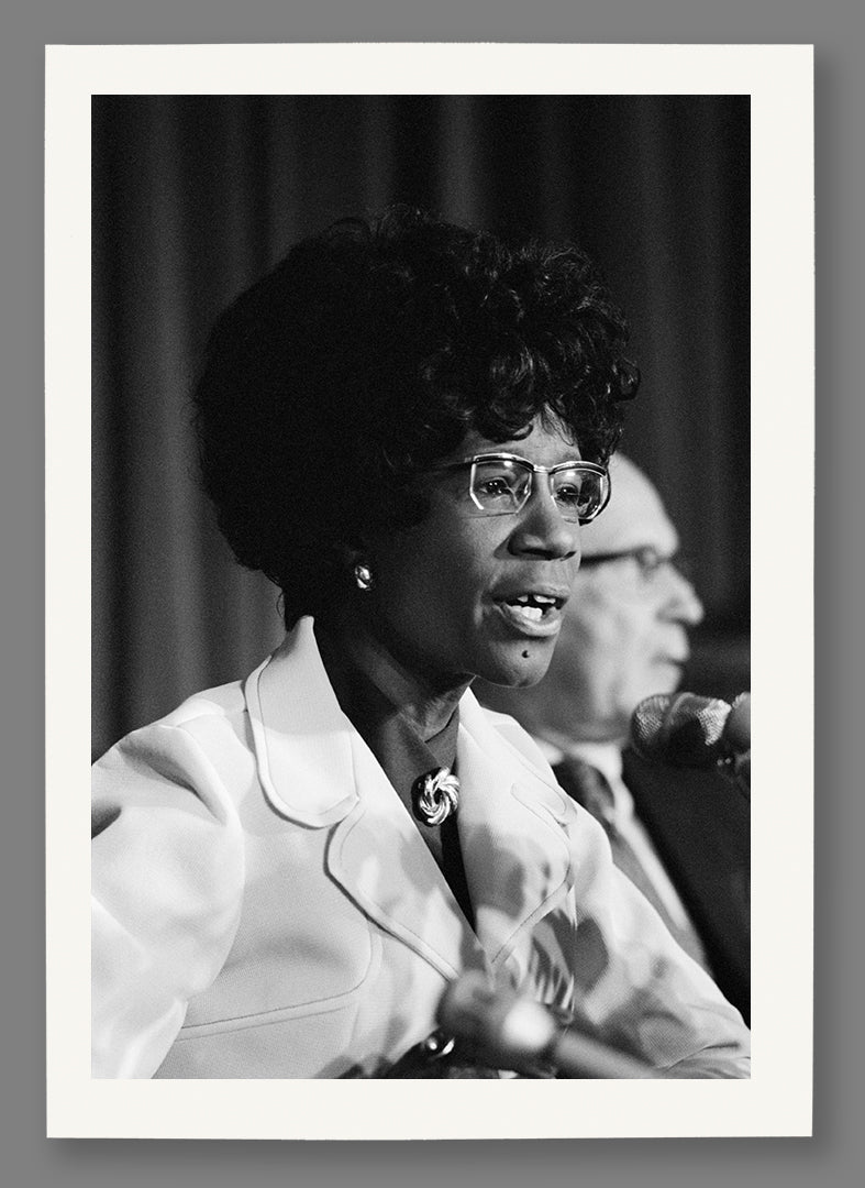 A paper print of a historic photograph of Shirley Chisholm
