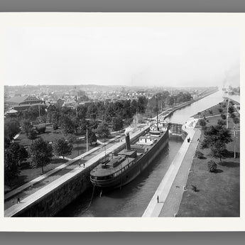 A print on fine art paper of a vintage photo of a ship traversing the locks at Sault Ste Marie