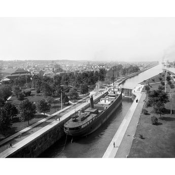 A vintage image of a ship going through the locks at Sault Ste Marie