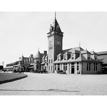 A vintage photograph of Union Station in Portland, Maine, with horse-drawn carriages outside