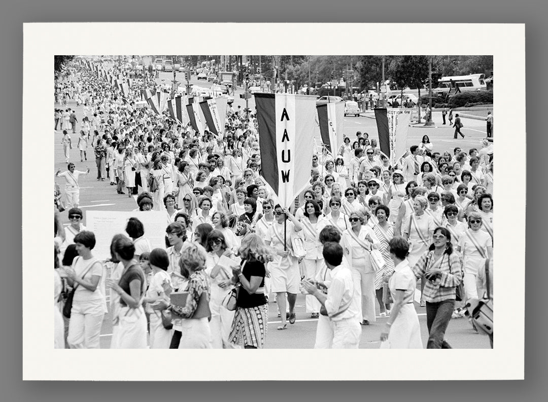 A paper print of a vintage photograph of a women's equal rights parade