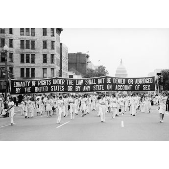 Protest march with a banner advocating for gender equality in Washington DC.