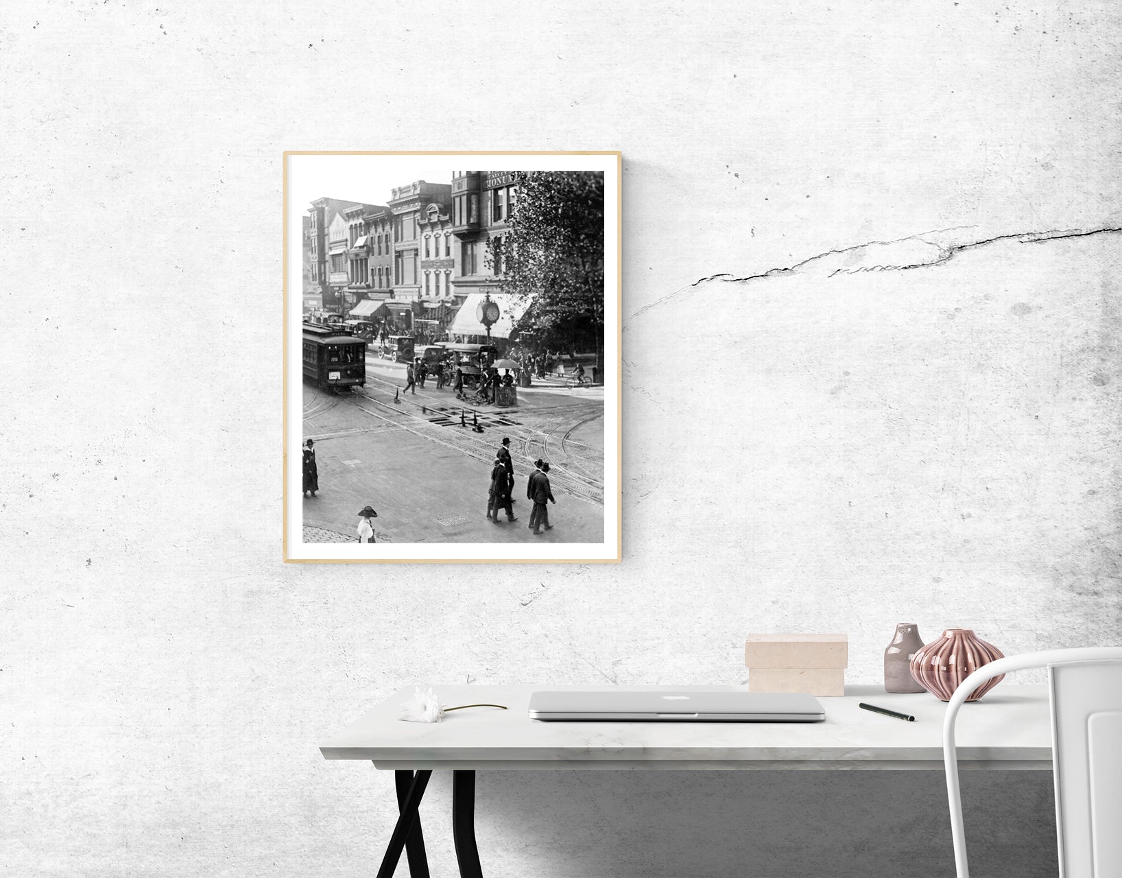 A framed print of a black and white photograph of Washington DC hanging in an office