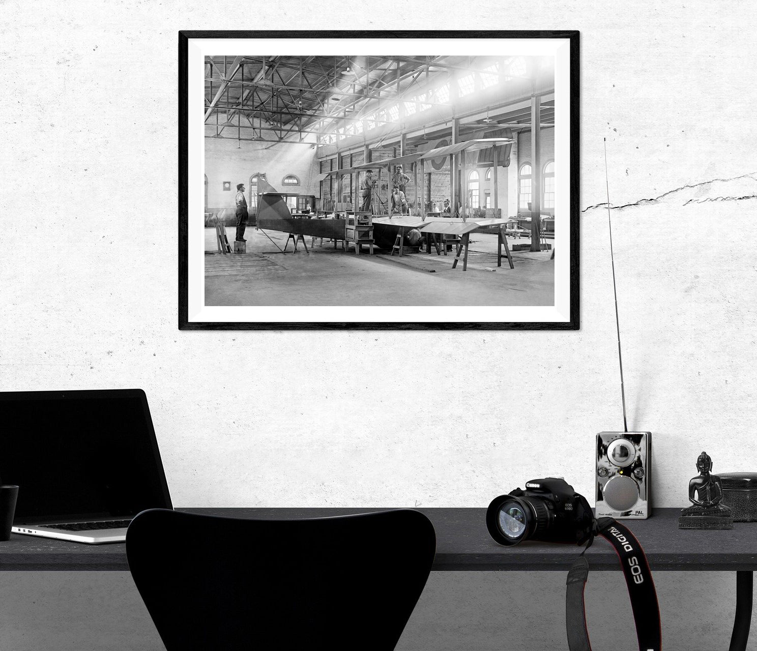 A framed paper print of a vintage photograph of Alexandria's airplane factory