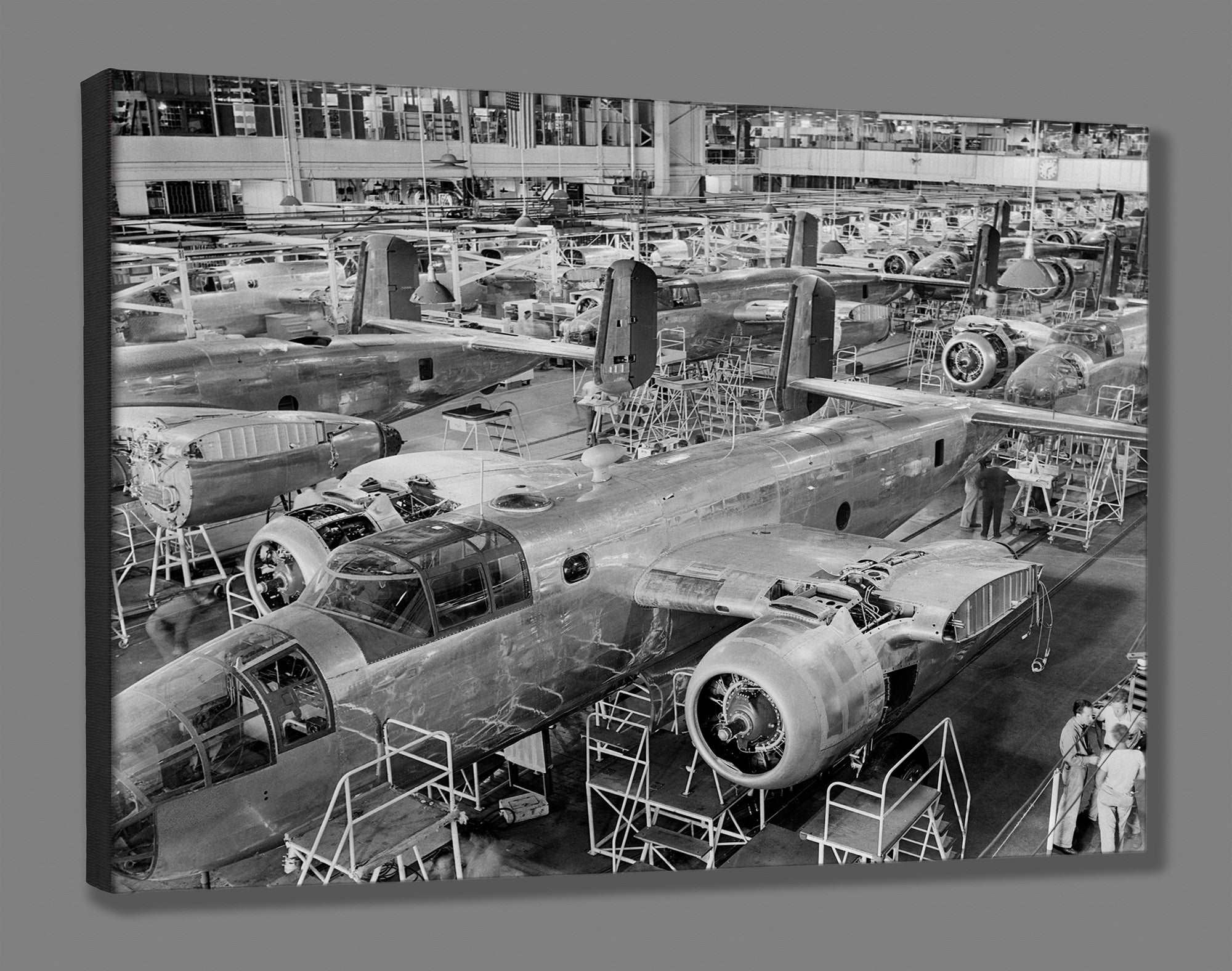 A canvas reproduction print of a photograph of the assembly of B-25 Bombers