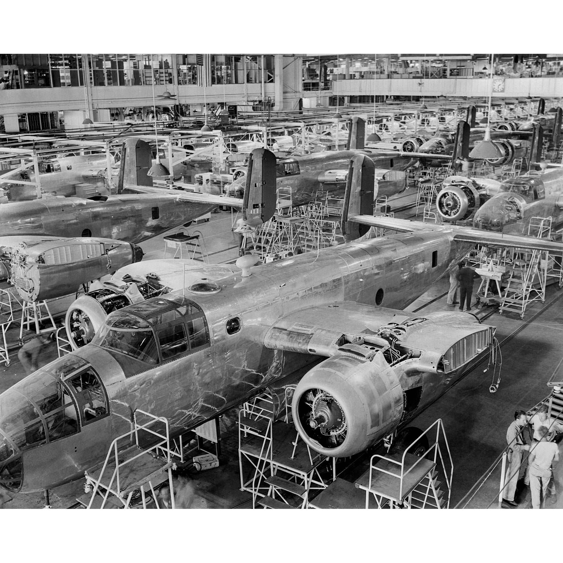 A vintage photograph of an assembly line of B-25 Bombers