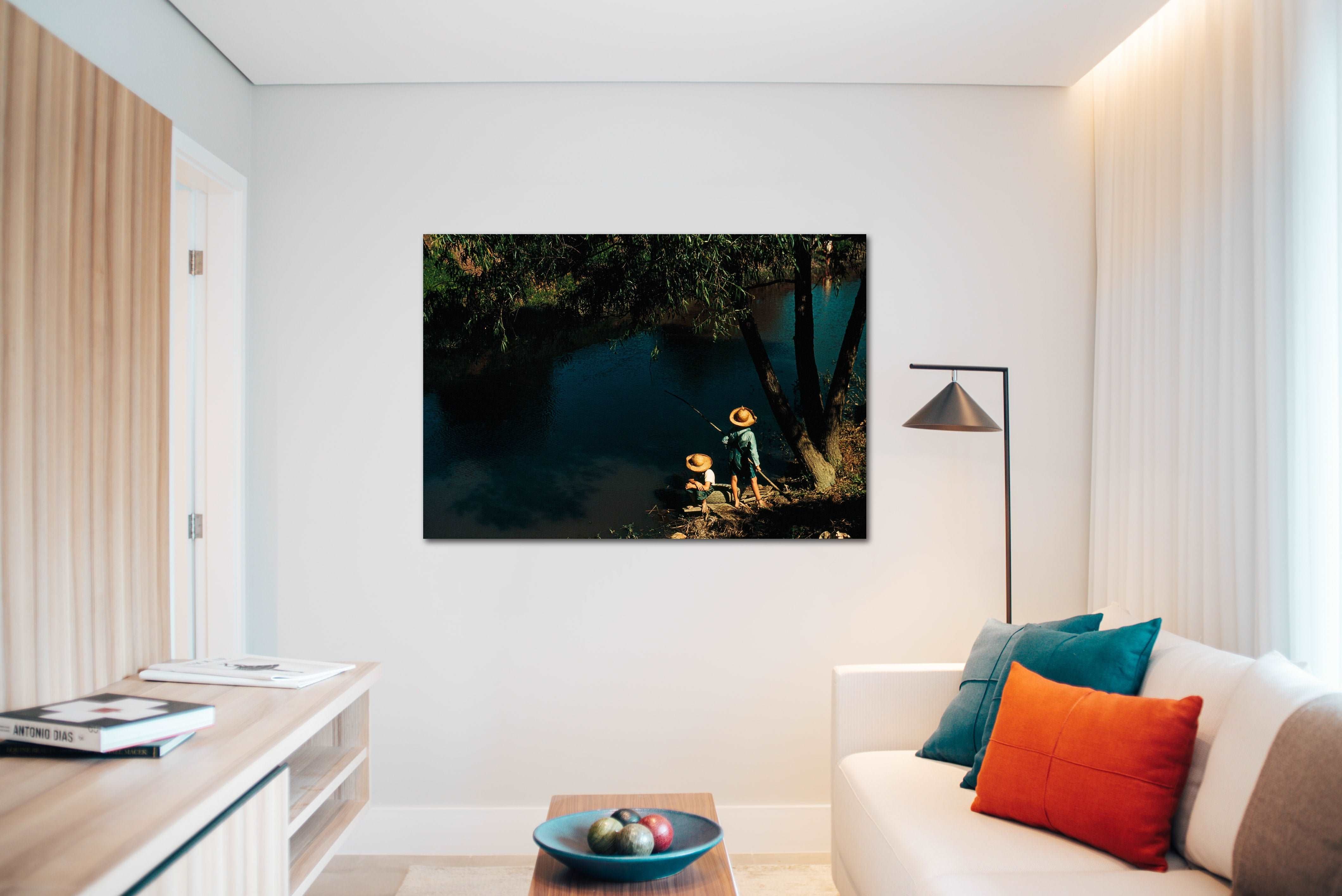 A canvas print of a vintage color photograph hanging on a living room wall