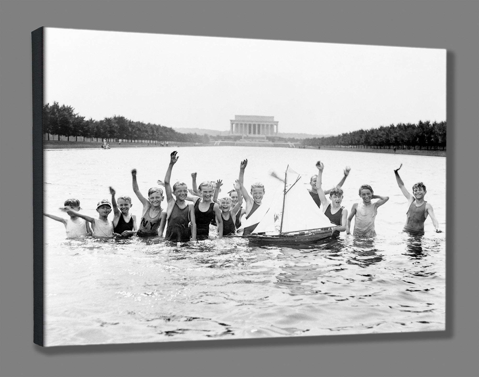 A canvas reproduction print of a vintage photograph of boys playing in the Reflecting Pool