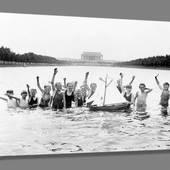 A canvas reproduction print of a vintage photograph of boys playing in the Reflecting Pool