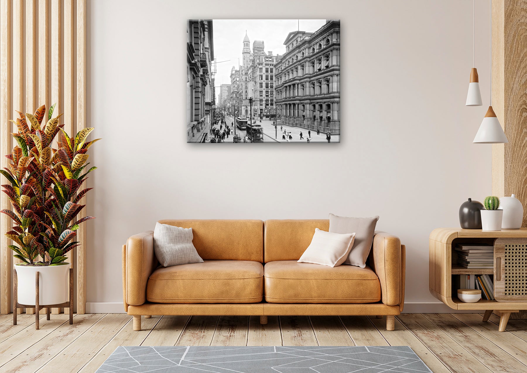 A canvas print of a photograph of Chestnut Street hanging above a yellow living room couch