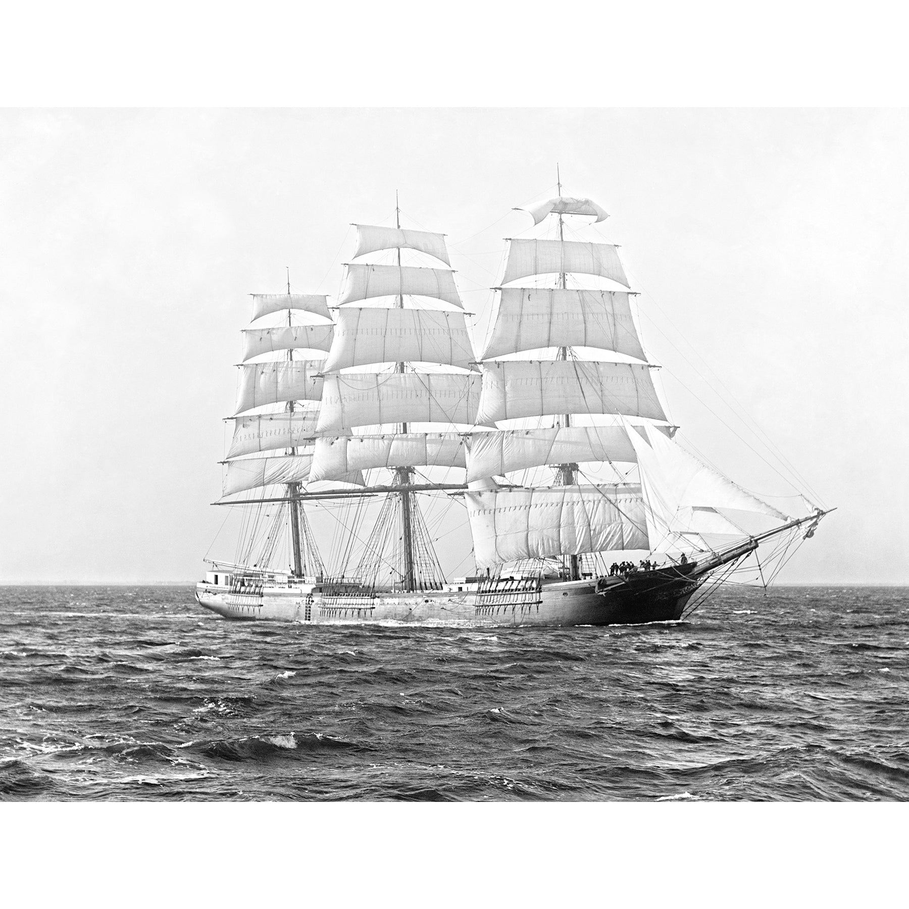 A vintage, black and white photograph of the Clipper Ship St. David on the water