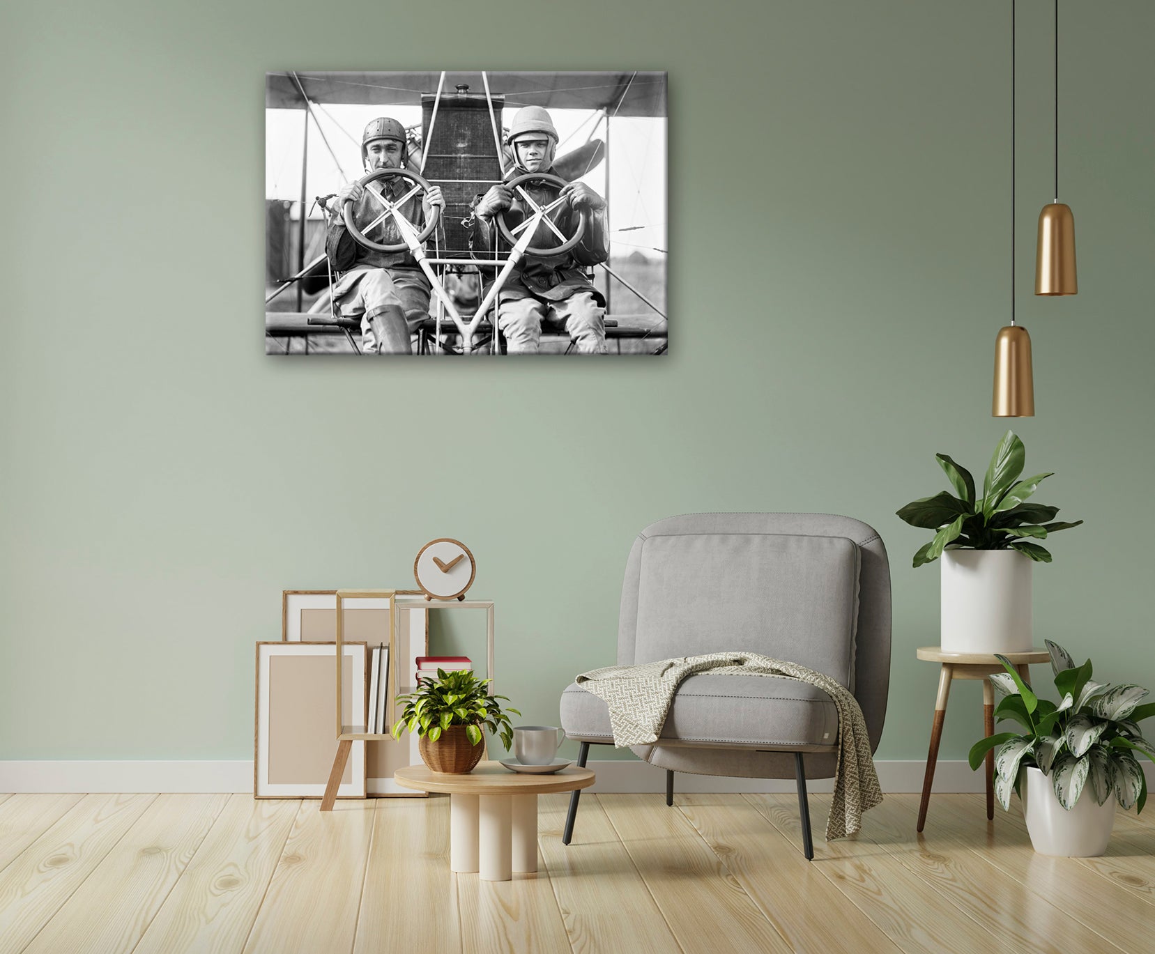 A canvas print of vintage photograph of two men in a plane hanging on a green living room wall