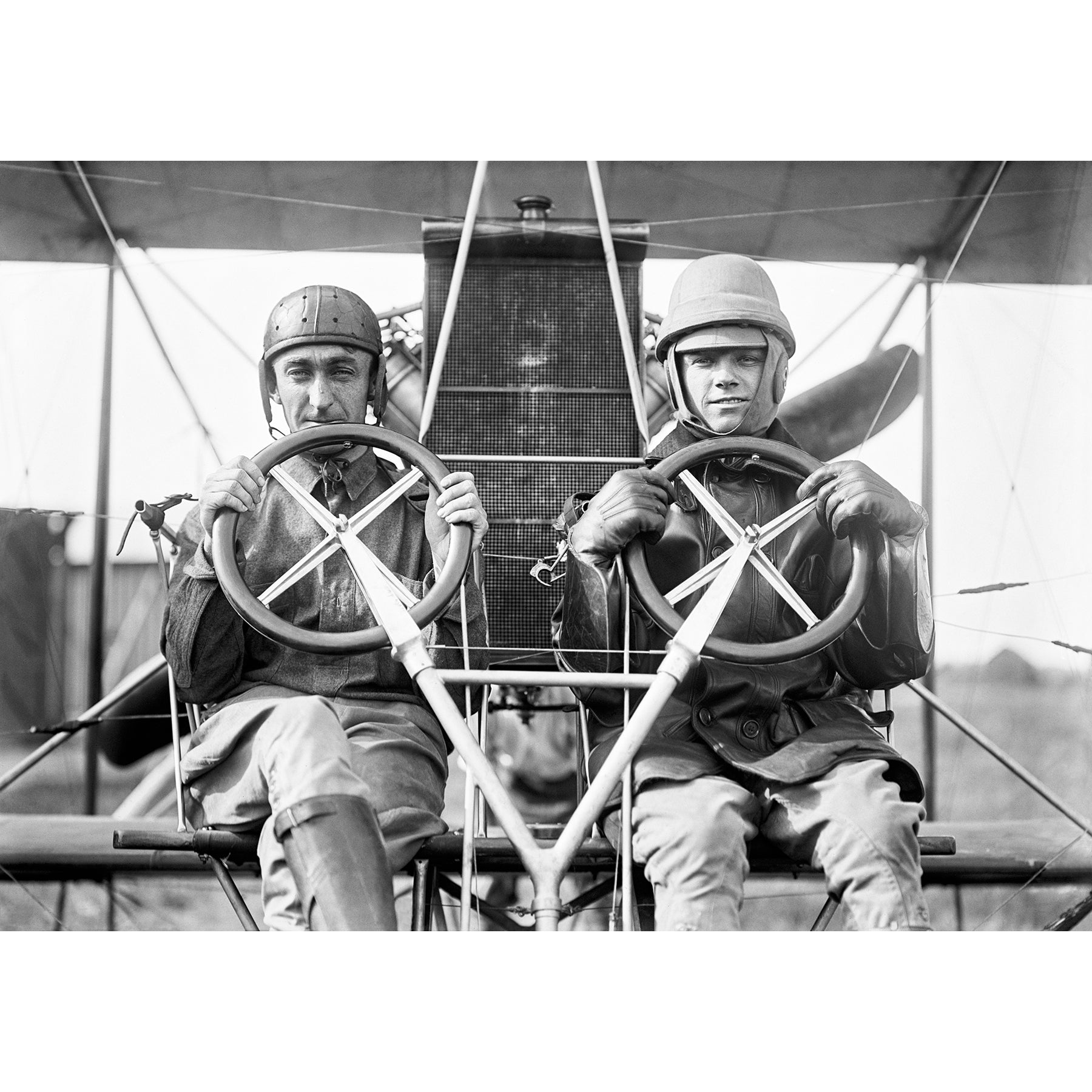 A vintage photograph of two men in a plane at College Park Aviation Field