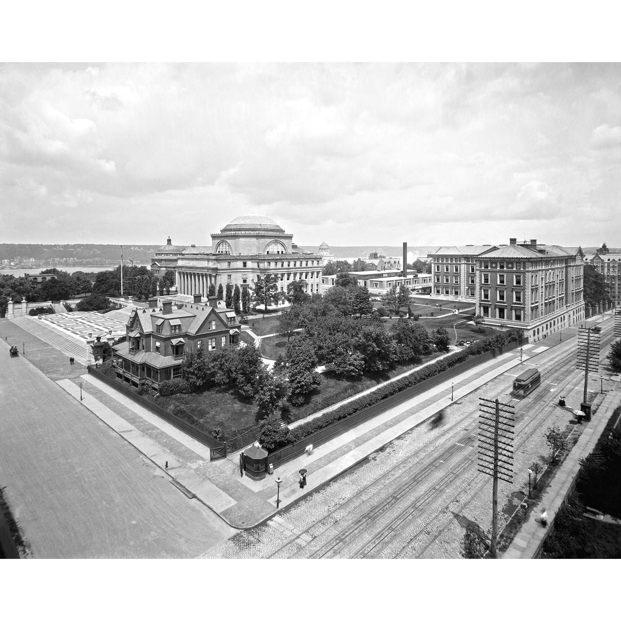 A vintage, black and white photograph of Columbia University with the Hudson River in the background