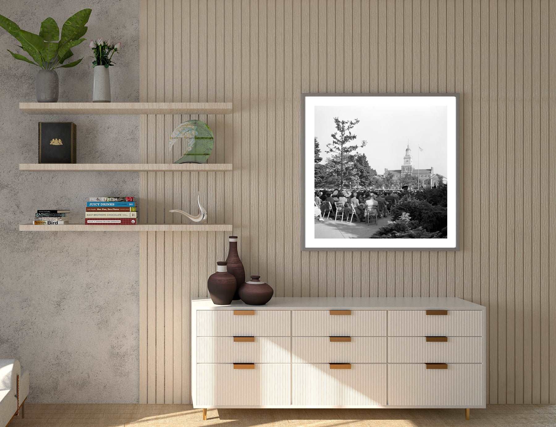 A room with modern decor and a framed paper print on the wall, featuring a vintage photograph of Howard University