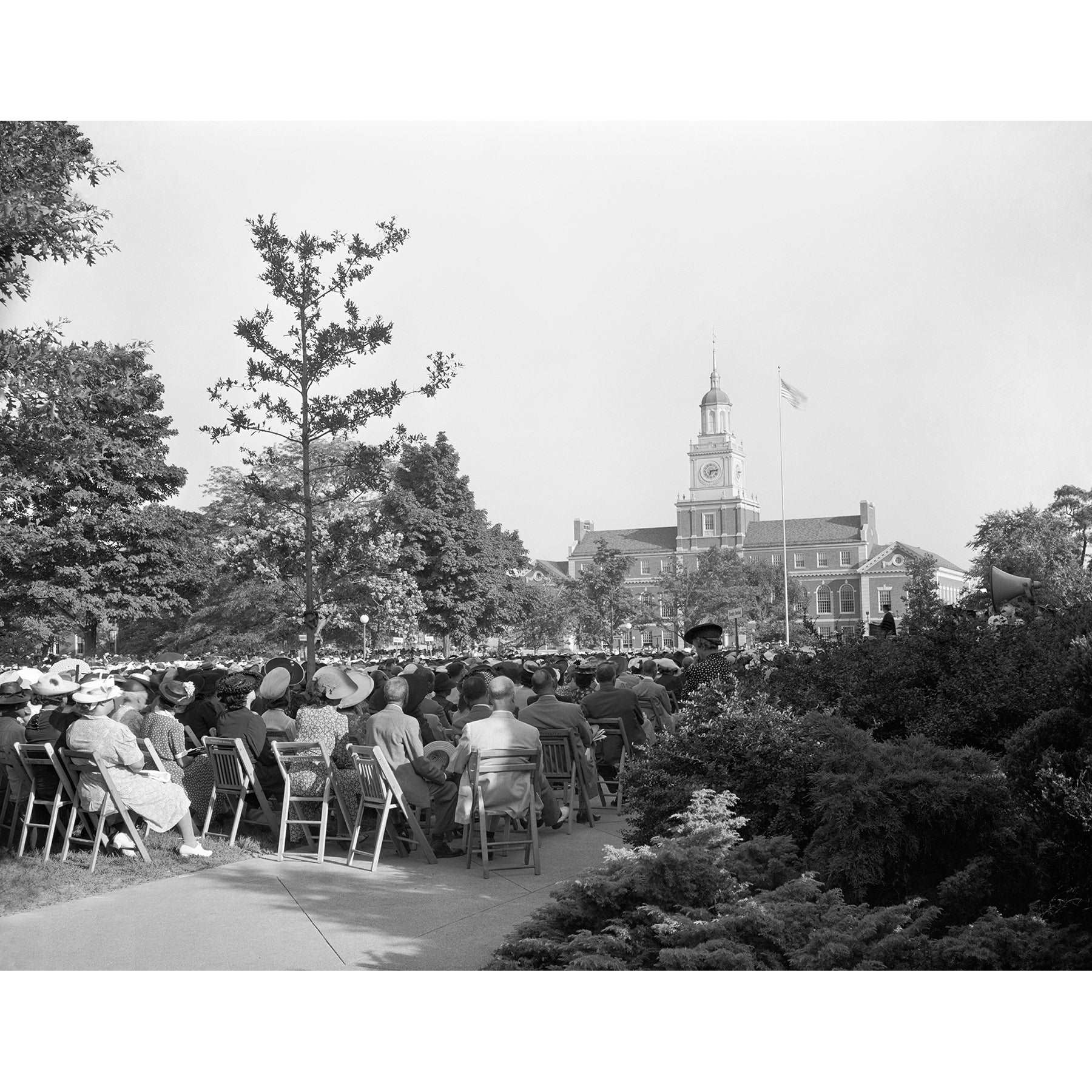 A vintage photograph depicting a seated crowd at a commencement ceremony at Howard University