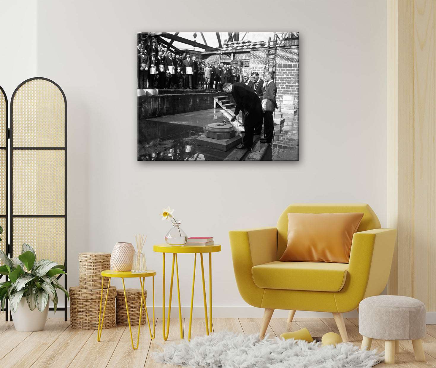 A living room with a canvas print on the wall, featuring a photograph of the dedication of the Washington Cathedral