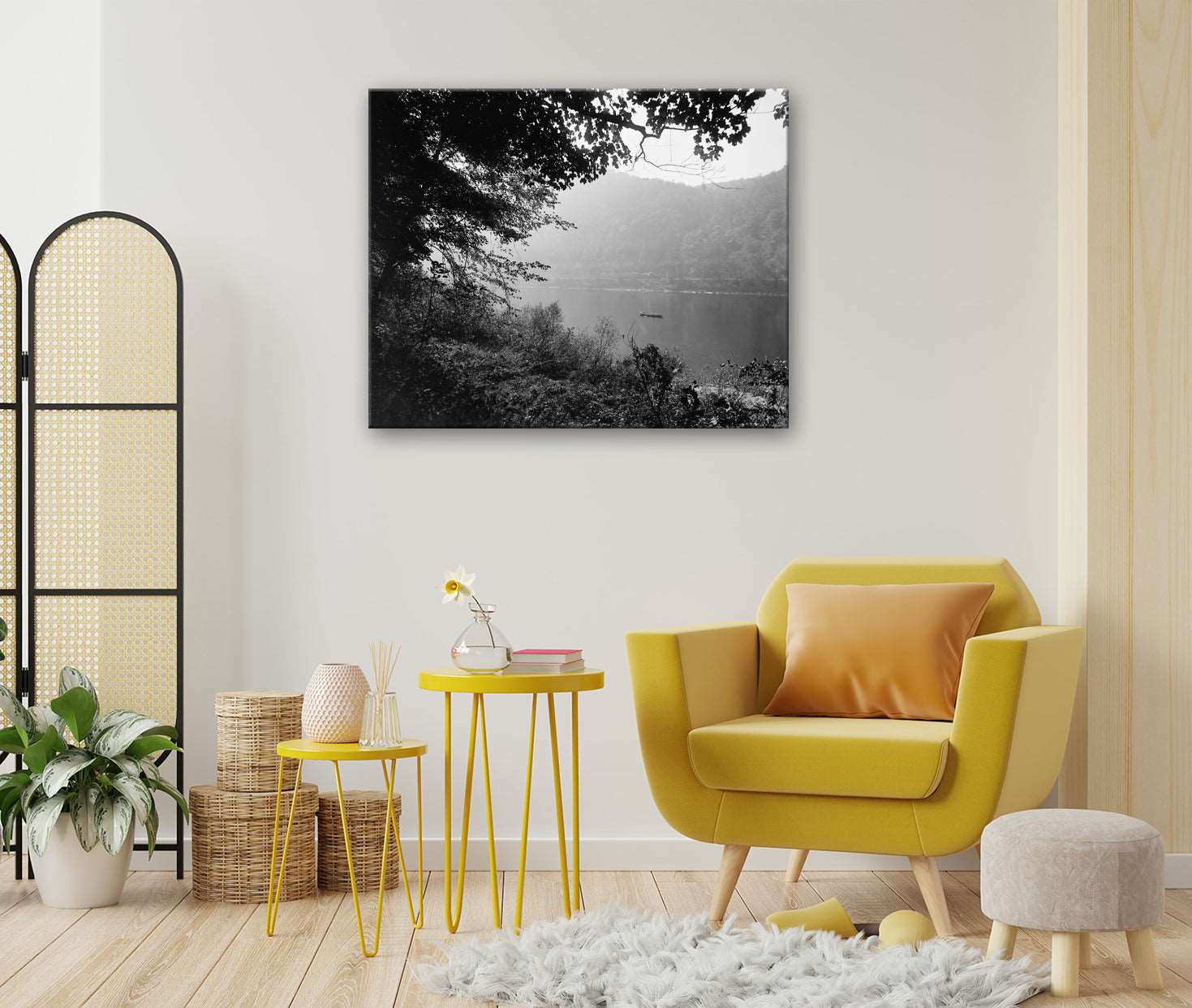 A canvas print hanging on a wall above furniture, featuring a vintage photograph of the Delaware River