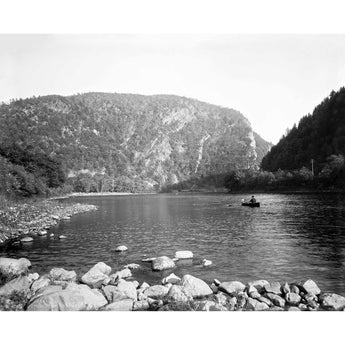 A vintage photograph of a man in a canoe on the Delaware Water Gap