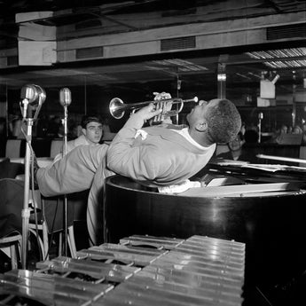 A black and white, vintage photograph of Dizzy Gillespie