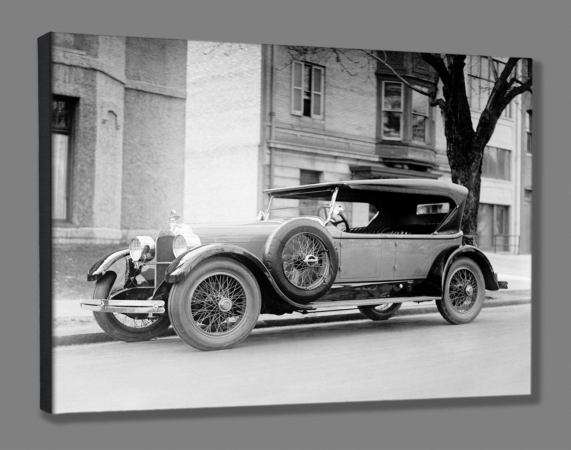 A canvas print of a vintage photograph of a Dusenberg Car parked on the street