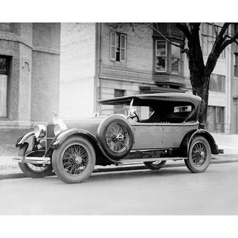 A vintage, black and white photograph of a Dusenberg Car