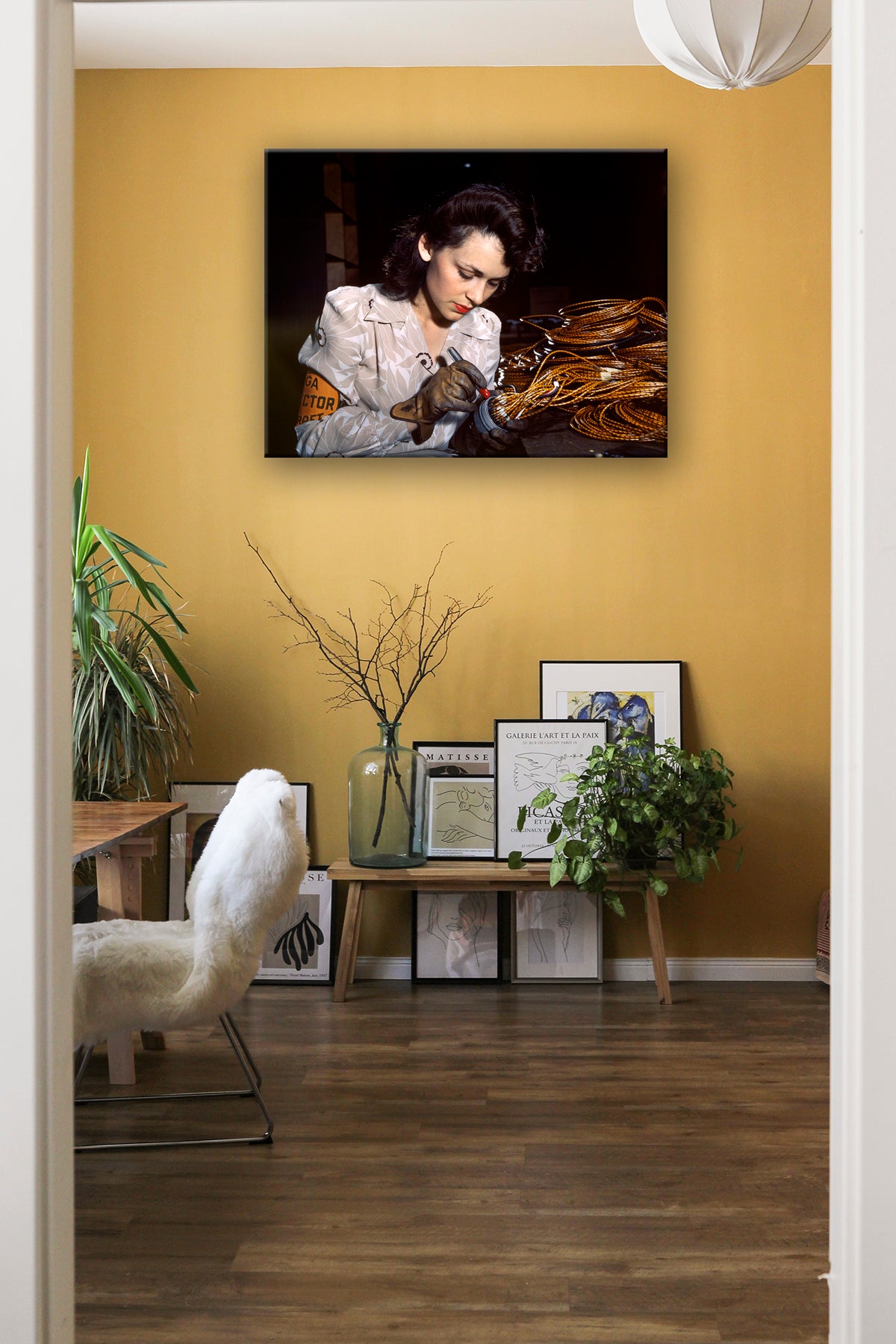 A digital rendering featuring a canvas print of a vintage photograph hanging on a yellow wall