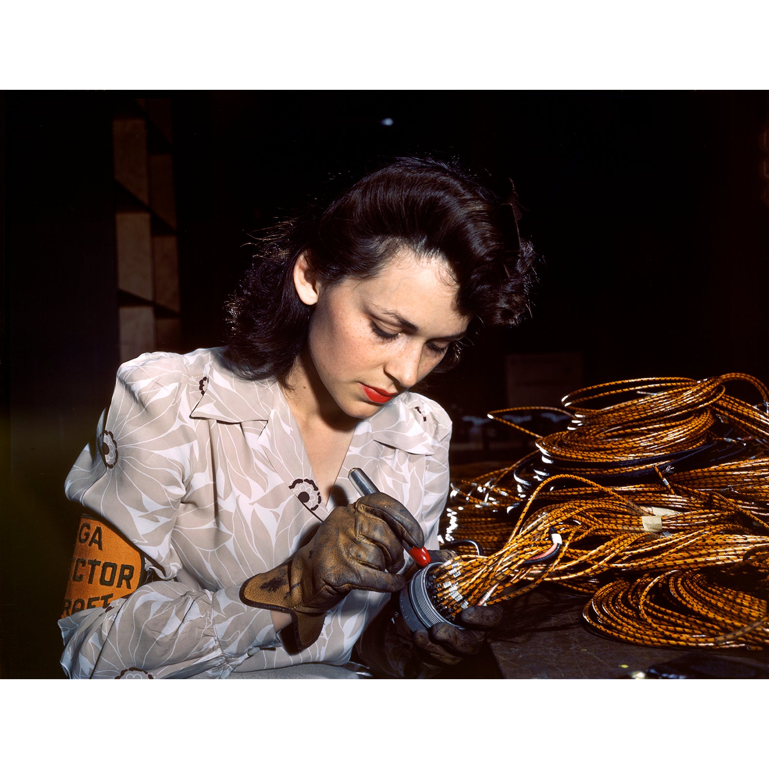 A vintage color photogrpah of a female aircraft worker in Burbank, CA