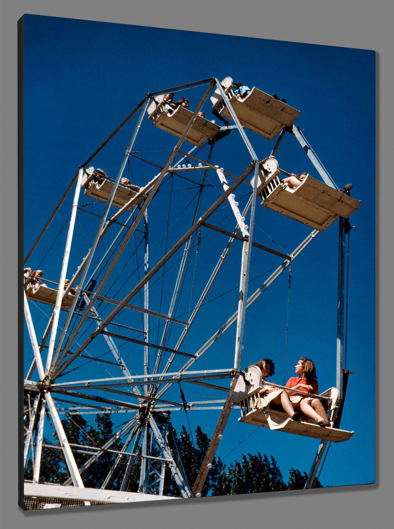 A print on canvas of vintage photography featuring a couples on a Ferris Wheel