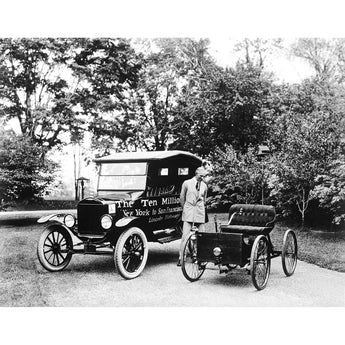A vintage photograph of Henry Ford standing between the first and ten millionth Ford vehicles