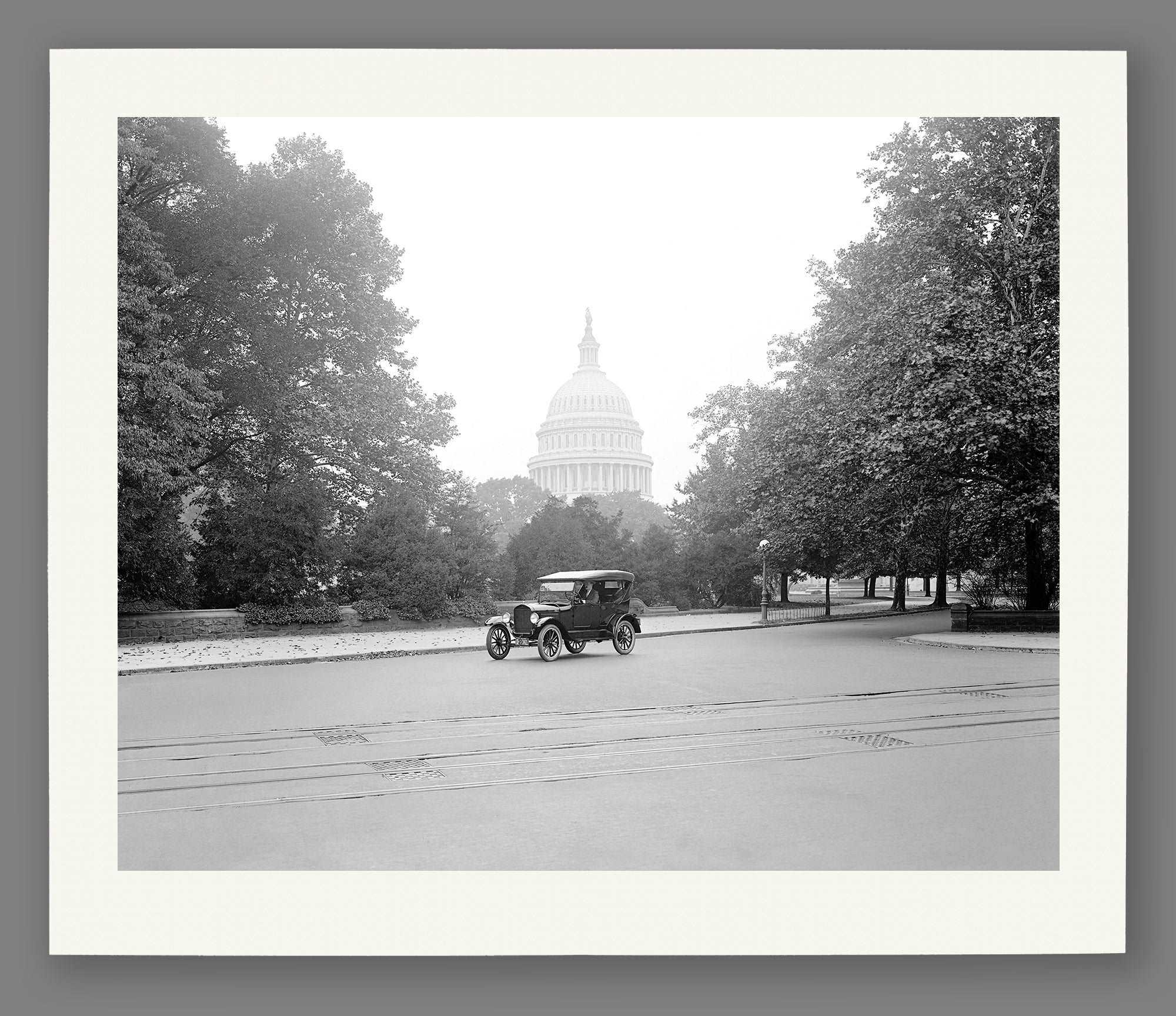 A fine art paper print of a vintage image of a Ford Touring Car in front of the Capitol Dome