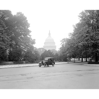 A vintage photograph of a Ford Touring Car in Washington DC with the Capitol Building in the background