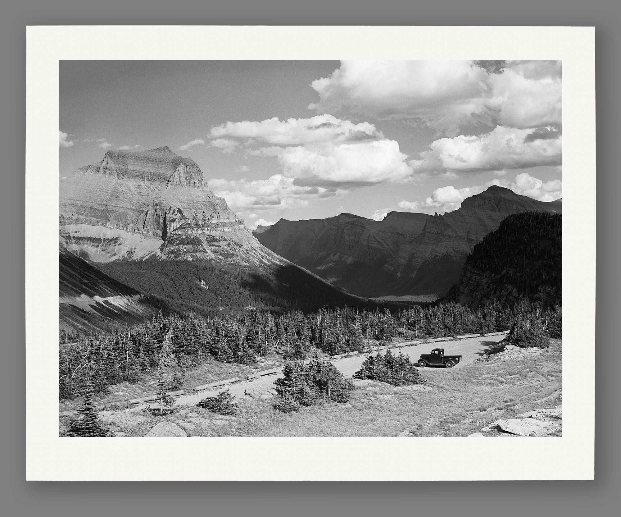 A mockup paper print of a vintage landscape image of Glacier National Park