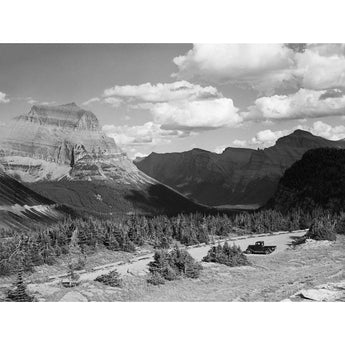 A black and white vintage photograph of a landscape in Glacier National Park