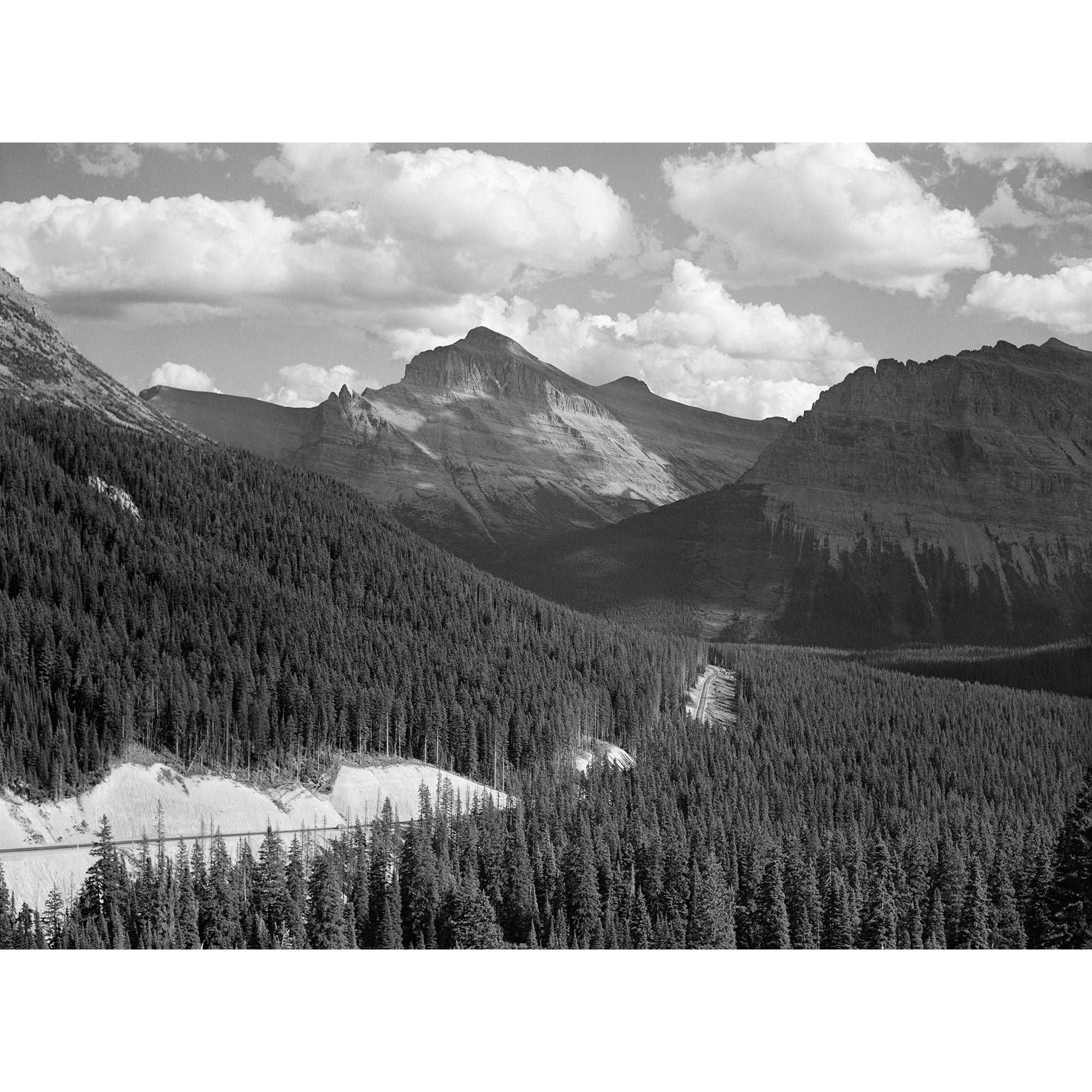 A vintage landscape photograph of mountains in Glacier National Park