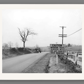 A paper print reproduction of a vintage photo of a car driving on US 50 in Virginia