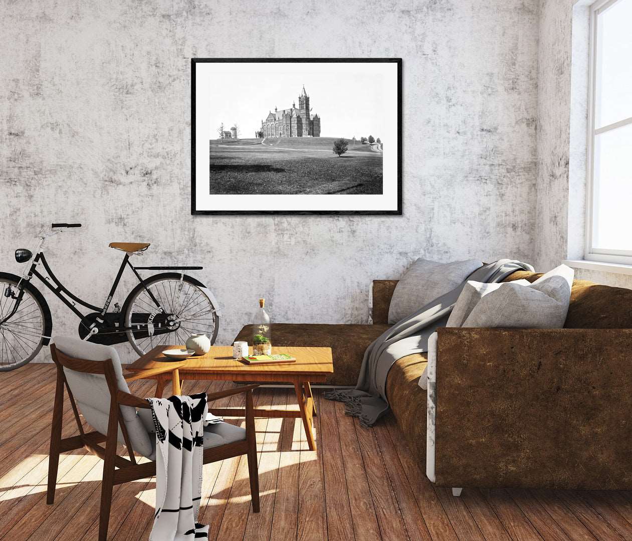 A modern living room with a large framed paper print of a photograph of J Crouse Hall