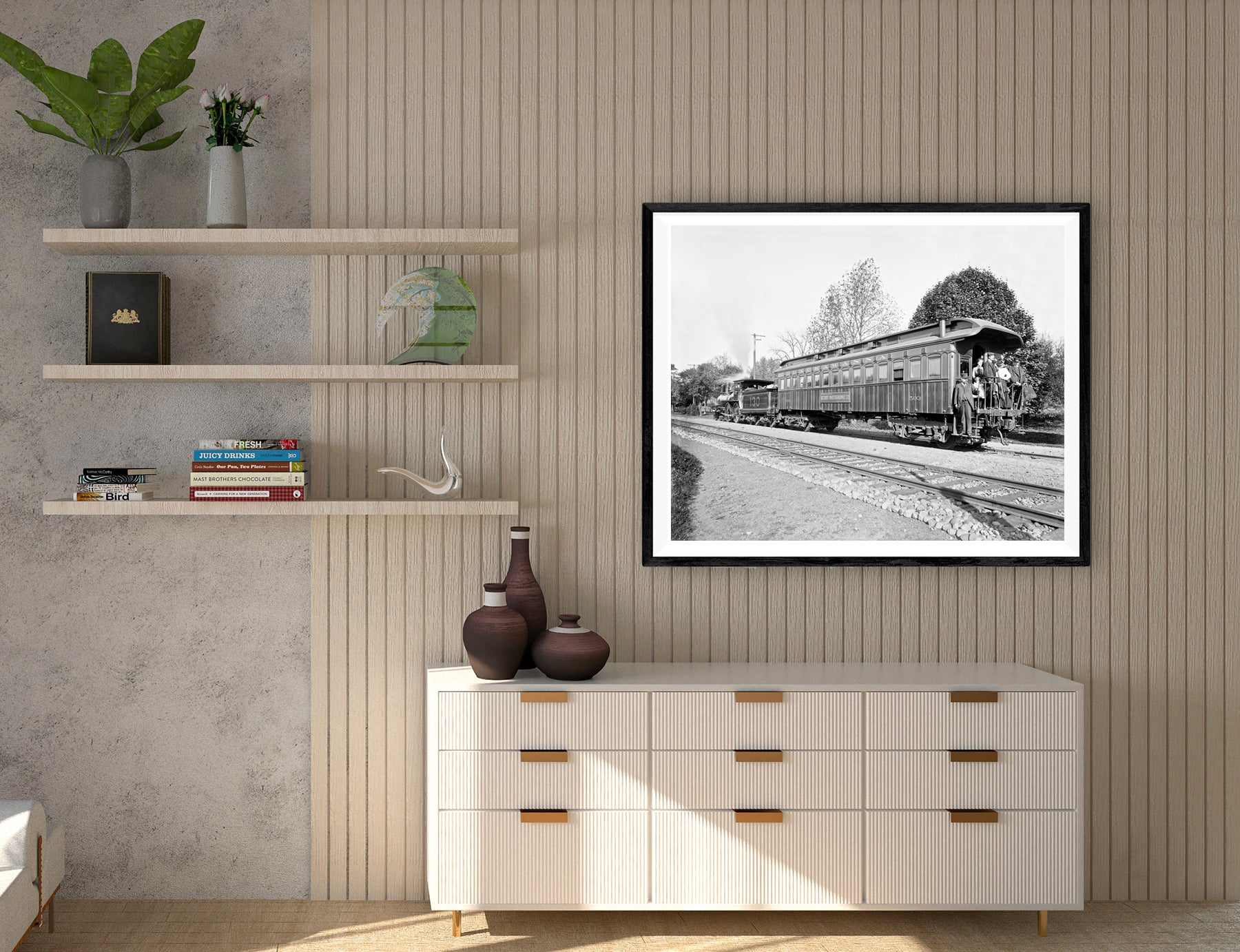 A framed paper print of a vintage photograph of a train car hanging on a slatted wall