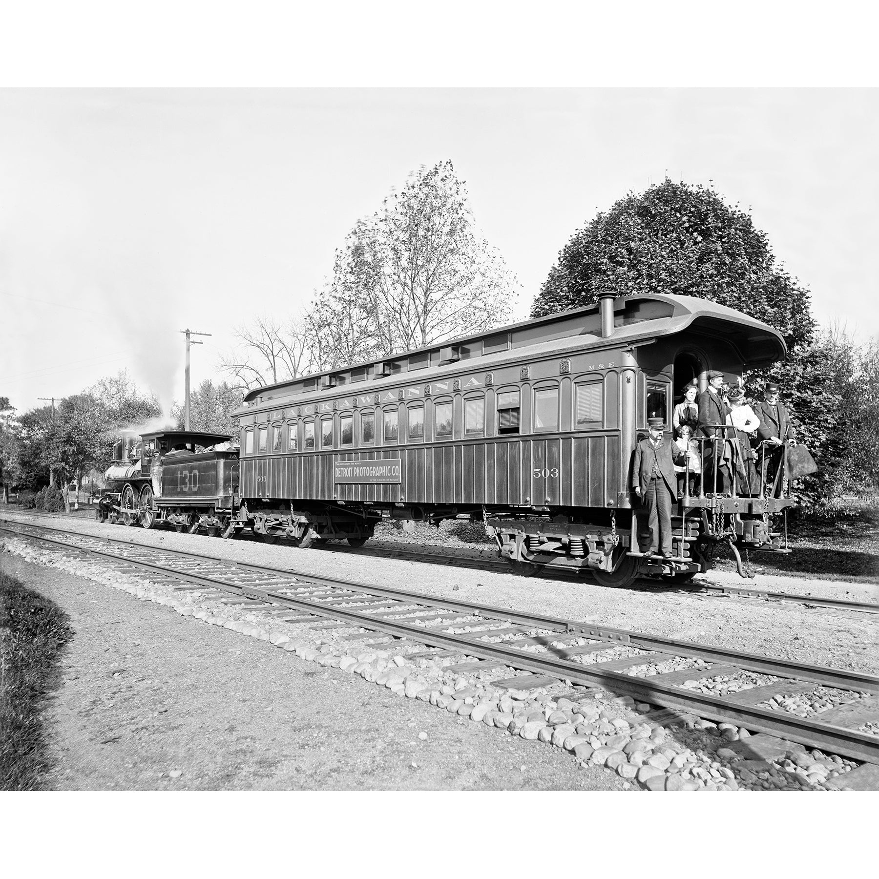 A vintage photograph featuring a Lackawanna Photo Train Car