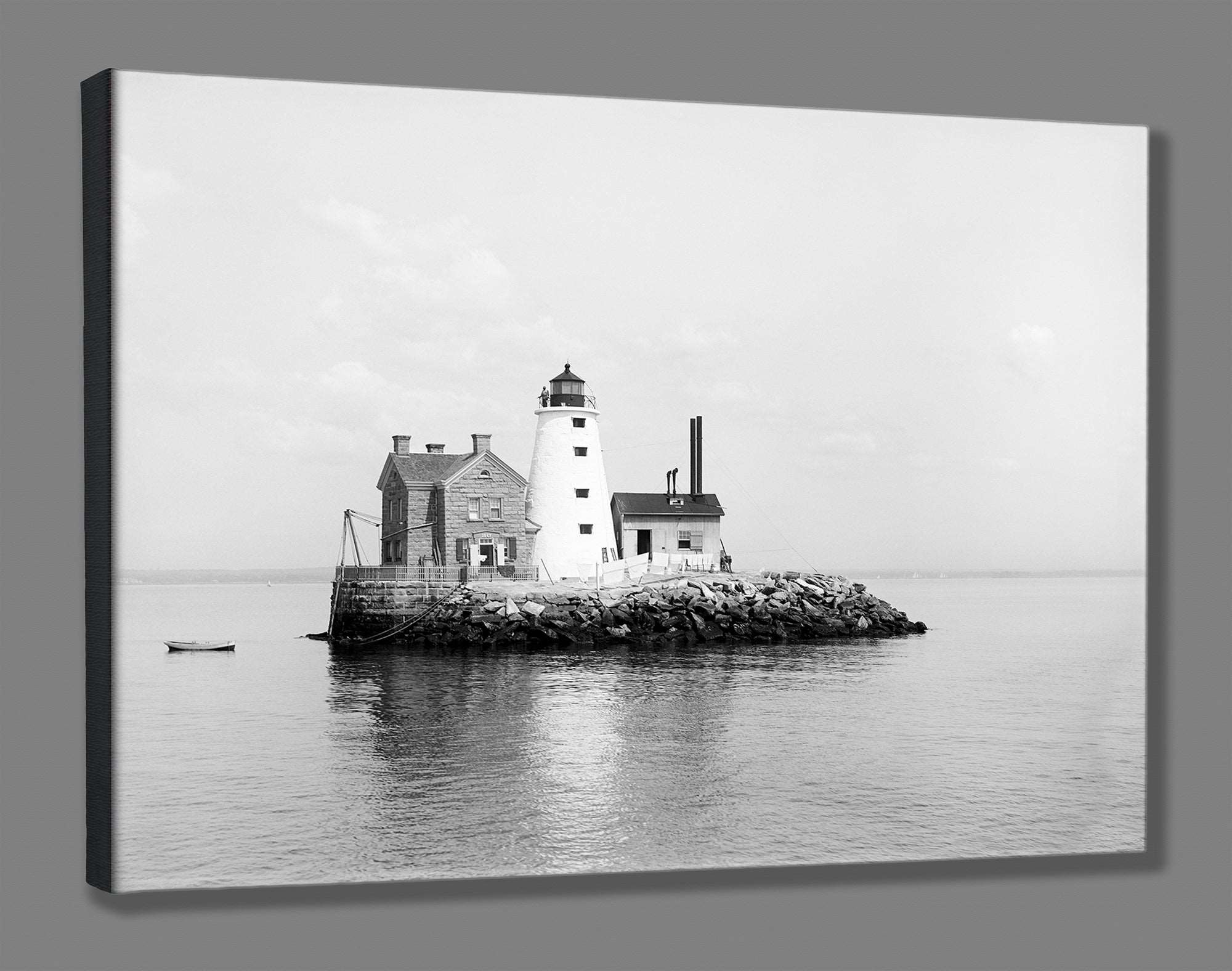 A canvas print of a vintage photograph of a lighthouse on an island