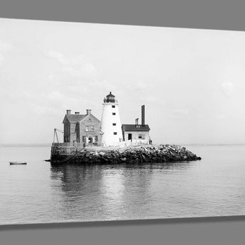 A canvas print of a vintage photograph of a lighthouse on an island