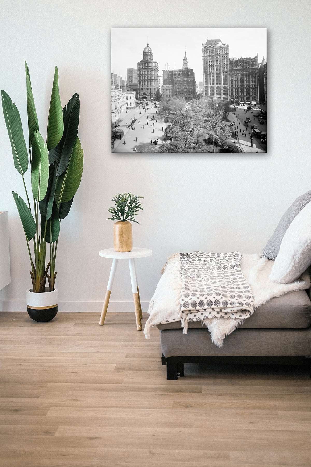 A canvas print of a photograph of New York City hanging in a living room