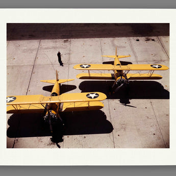 A fine art paper print of a vintage color photograph of planes