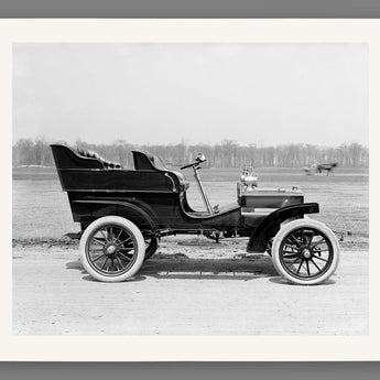A fine art paper print of a vintage photograph of a vintage vehicle