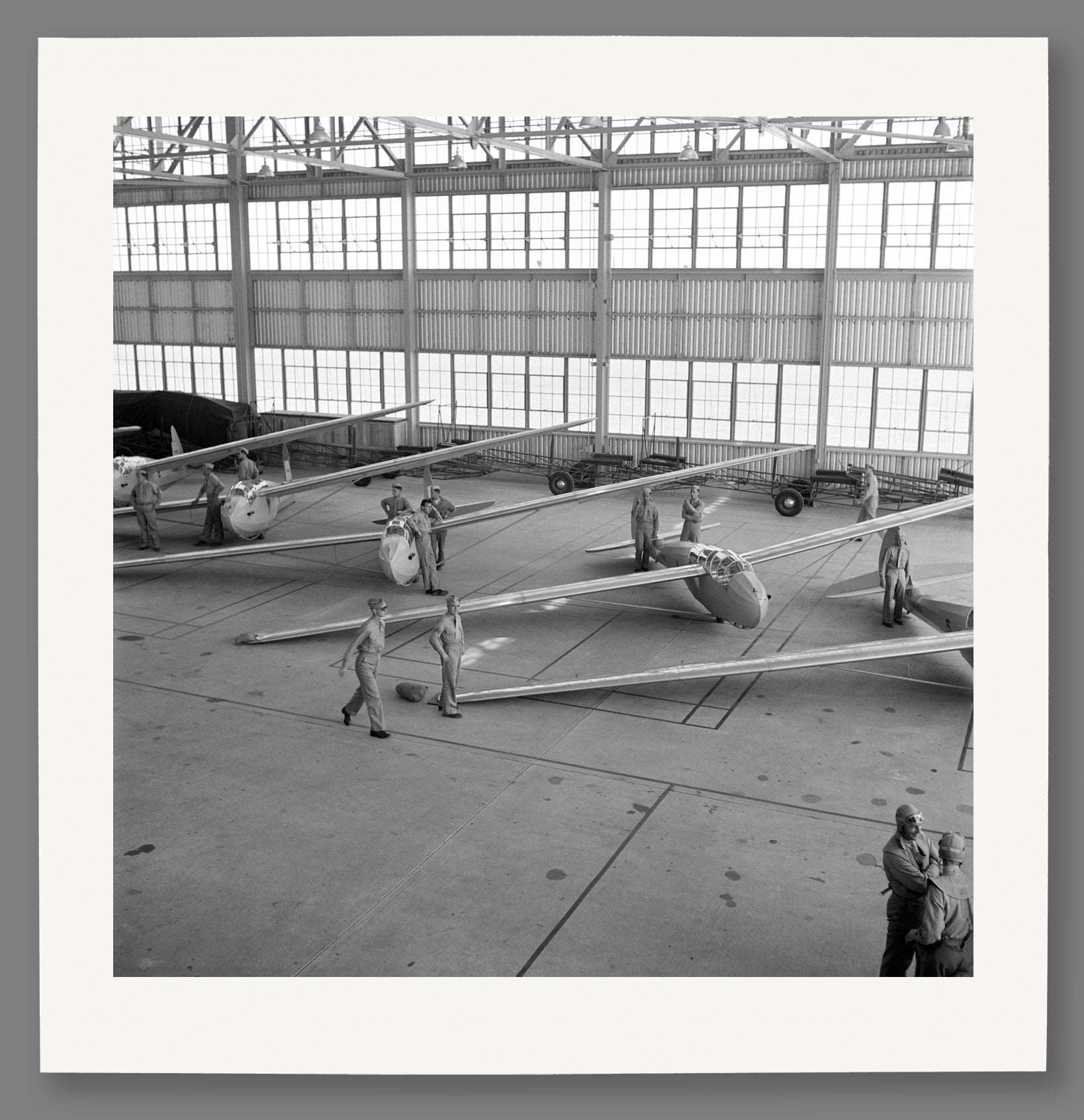 A paper print reproduction of a black and white photograph of USMC planes