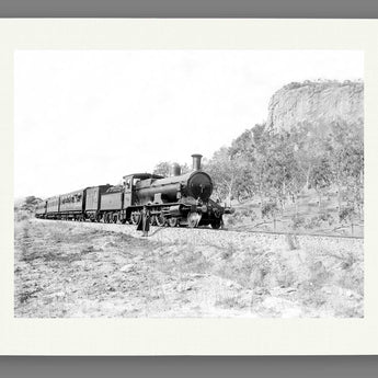 A fine art paper print of a vintage photograph of a passenger train
