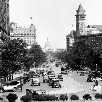 A vintage photograph of Pennsylvania Avenue in Washington DC, with the Capitol Building in the background